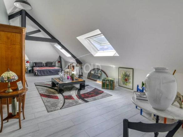 Interior of a renovated house with a view of the tidal creek, bright living room and contemporary decor.