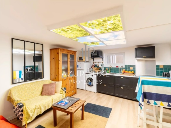 Interior of a house with fitted kitchen and bright living room, contemporary style.