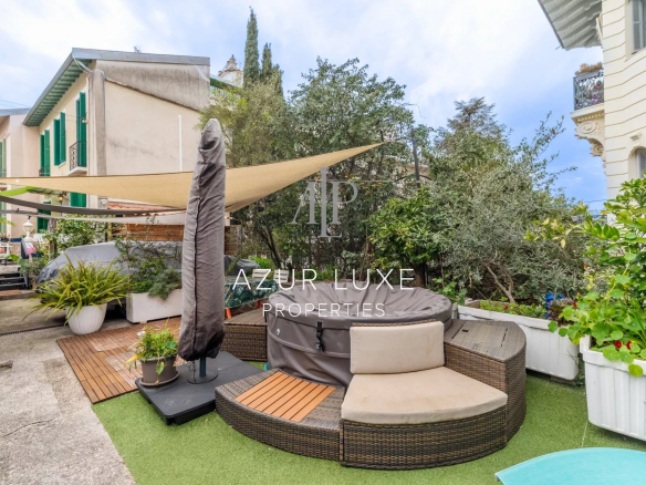 Terrace with jacuzzi and garden furniture in a house in Nice, Bas-Cimiez.