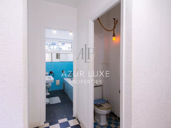 Interior of an apartment to be renovated with visible bathroom and toilet.