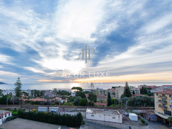 Panoramic sea view from an apartment in Beaulieu-sur-Mer, with clouds in the sky.