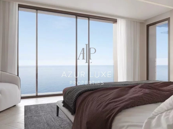 Chambre moderne avec vue sur la mer, grandes fenêtres et décoration contemporaine.