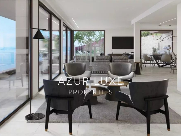 Intérieur moderne d'une villa avec vue sur la mer, salon lumineux et mobilier contemporain.