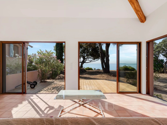 Interior of a villa in Rayol-Canadel-sur-Mer with sea view, large bay windows.