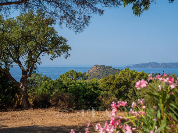 Panoramic sea view from a villa in Rayol-Canadel-sur-Mer, with flowers in the foreground.