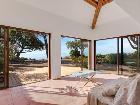 Interior of a villa in Rayol-Canadel-sur-Mer with sea view and large bay windows.