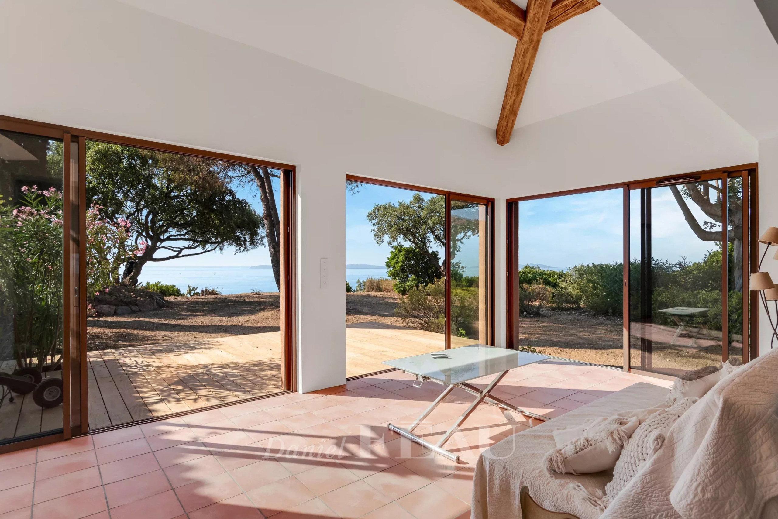 Villa with sea view in Rayol-Canadel-sur-Mer Interior of a villa in Rayol-Canadel-sur-Mer with sea view and large bay windows.