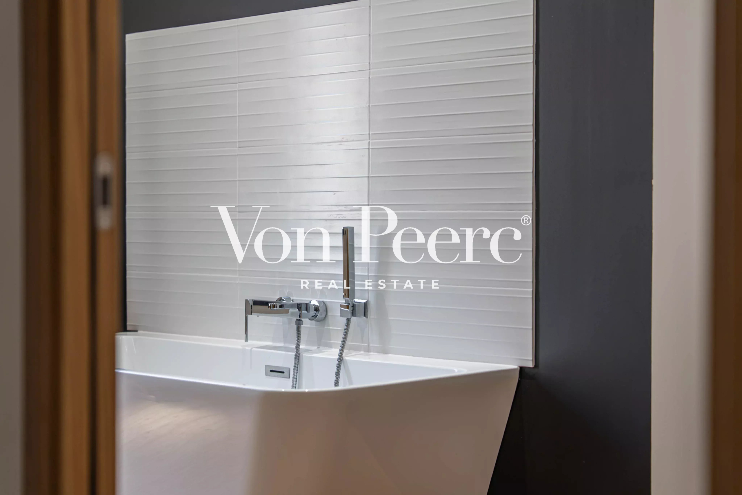 Contemporary bathroom Modern bathroom with designer bathtub and tiled wall