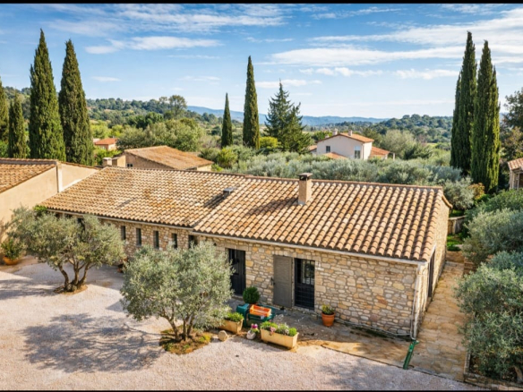 In the heart of Eygalières, a superb stone property with outbuildings