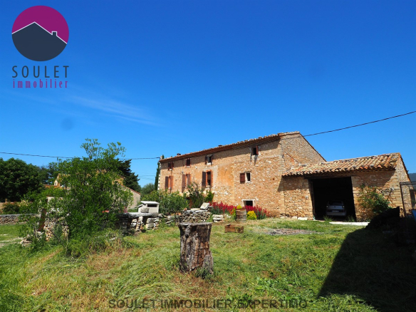 Farmhouse with view and outbuildings
