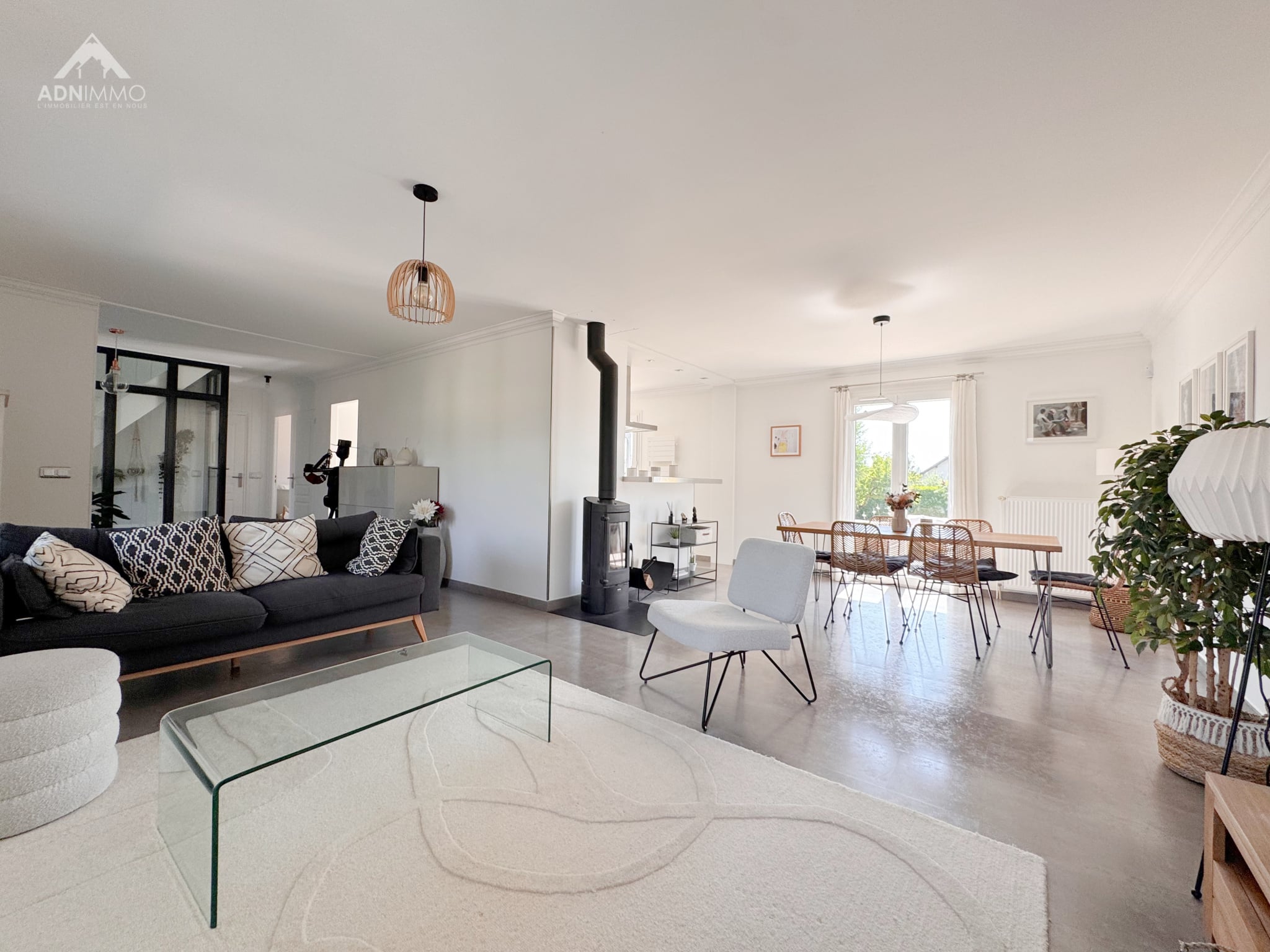 Interior of a house in Saint-Genis-Pouilly Interior of a renovated house with living room and dining room, modern furniture and elegant decoration.