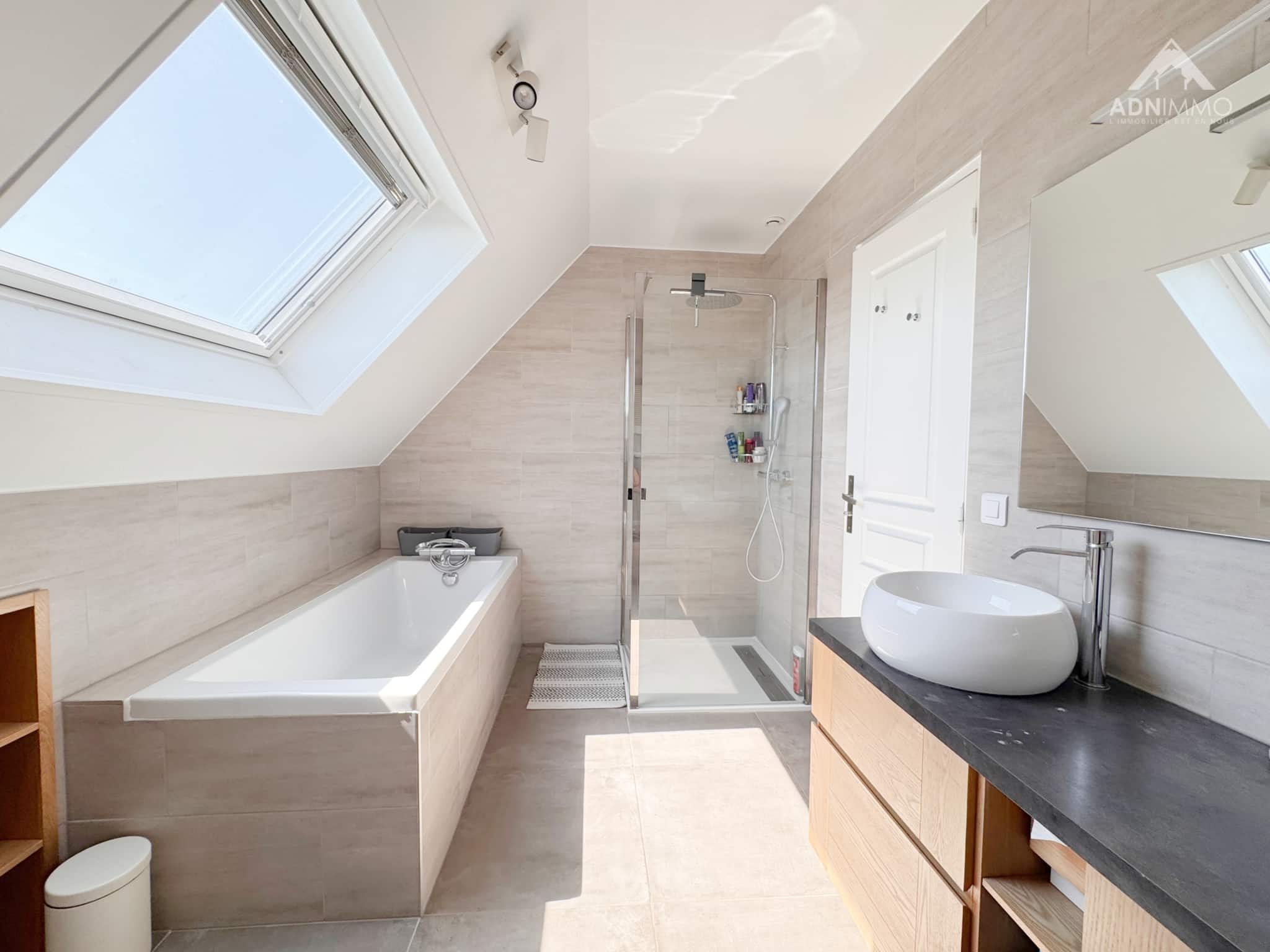 Contemporary bathroom Modern bathroom with bathtub and shower, skylights, wooden furniture.
