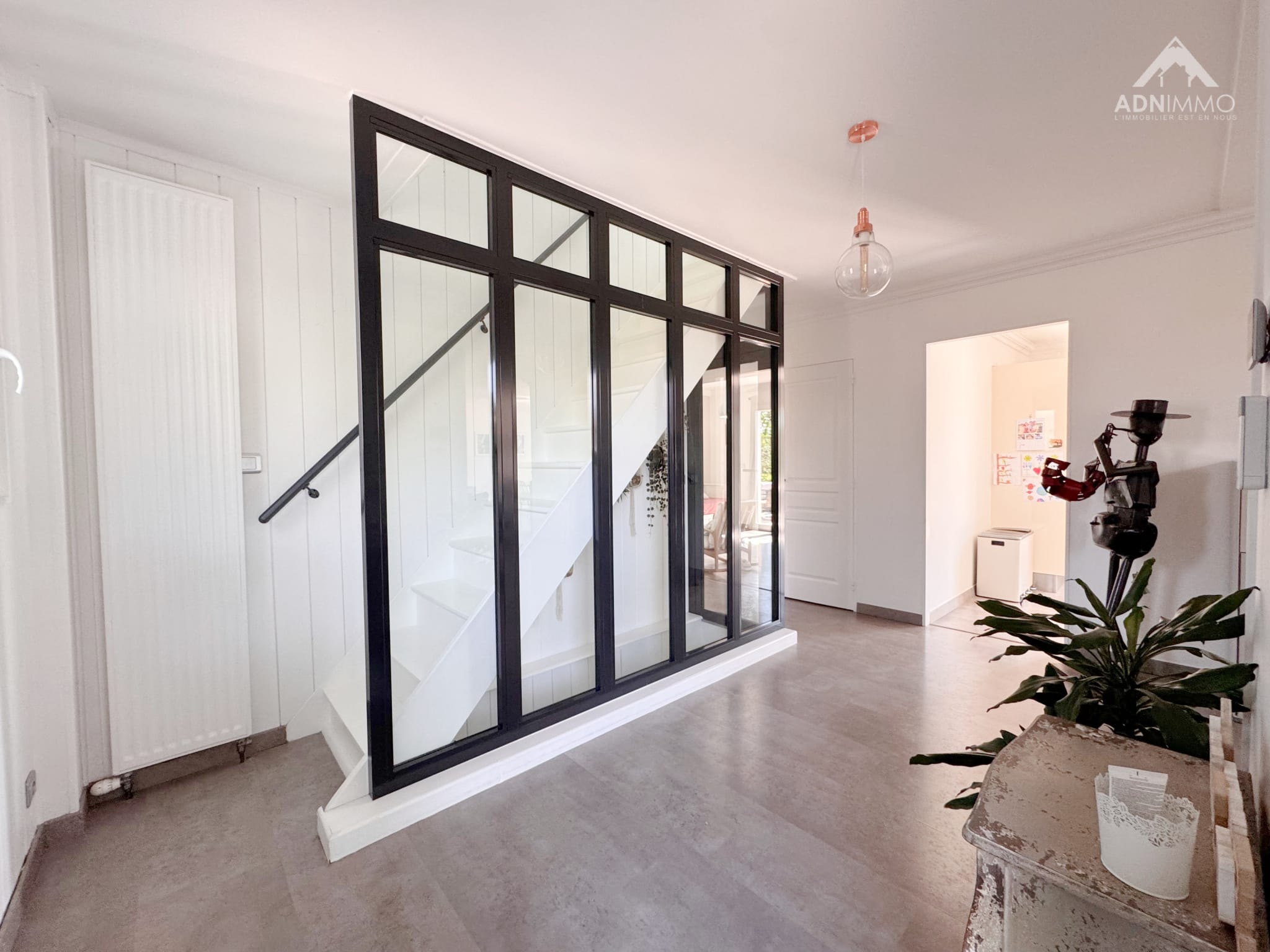 Interior of a house in Saint-Genis-Pouilly Interior of a modern house with a staircase and glass walls.