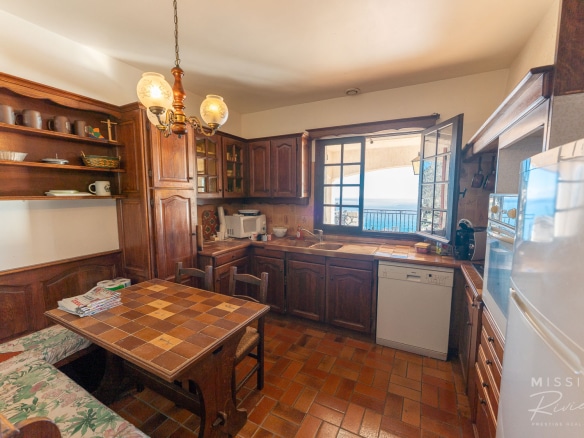 Traditional wooden kitchen with sea view, in La Turbie.