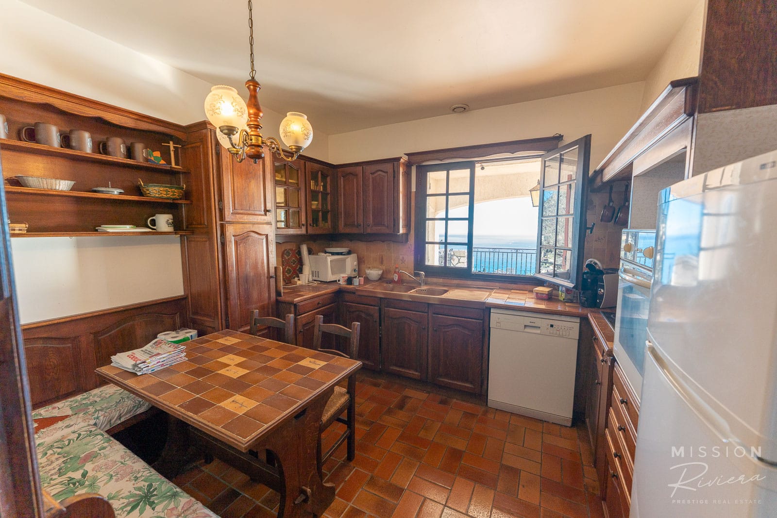 Provençal villa cuisine in La Turbie Traditional wooden kitchen with sea view, in La Turbie.