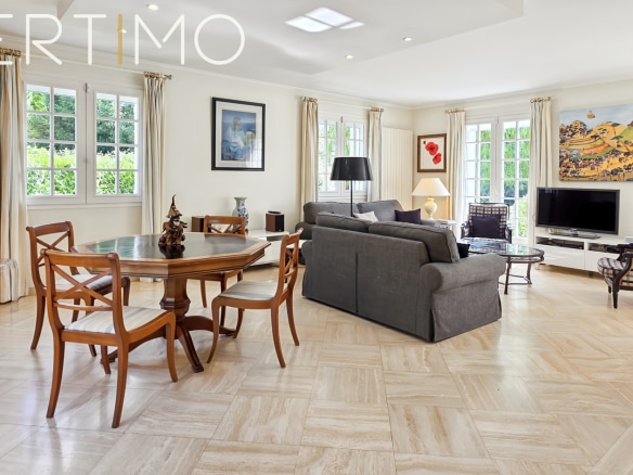 Interior of an elegant family property with a bright living room and dining area.