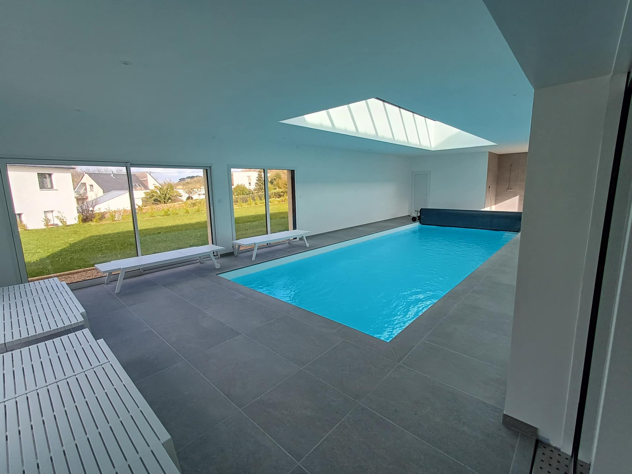 Interior of a Breton stone house with an indoor swimming pool in Plougasnou.