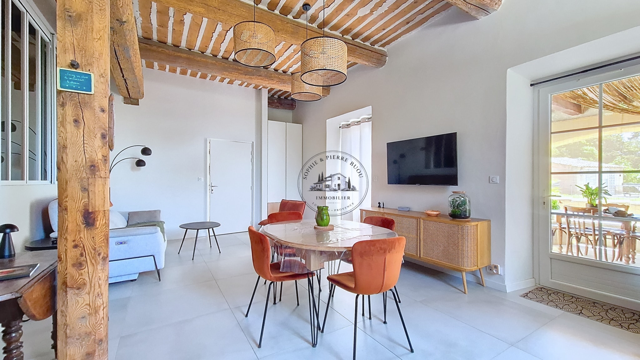 Interior of an 18th-century building with exposed beams and modern furniture.