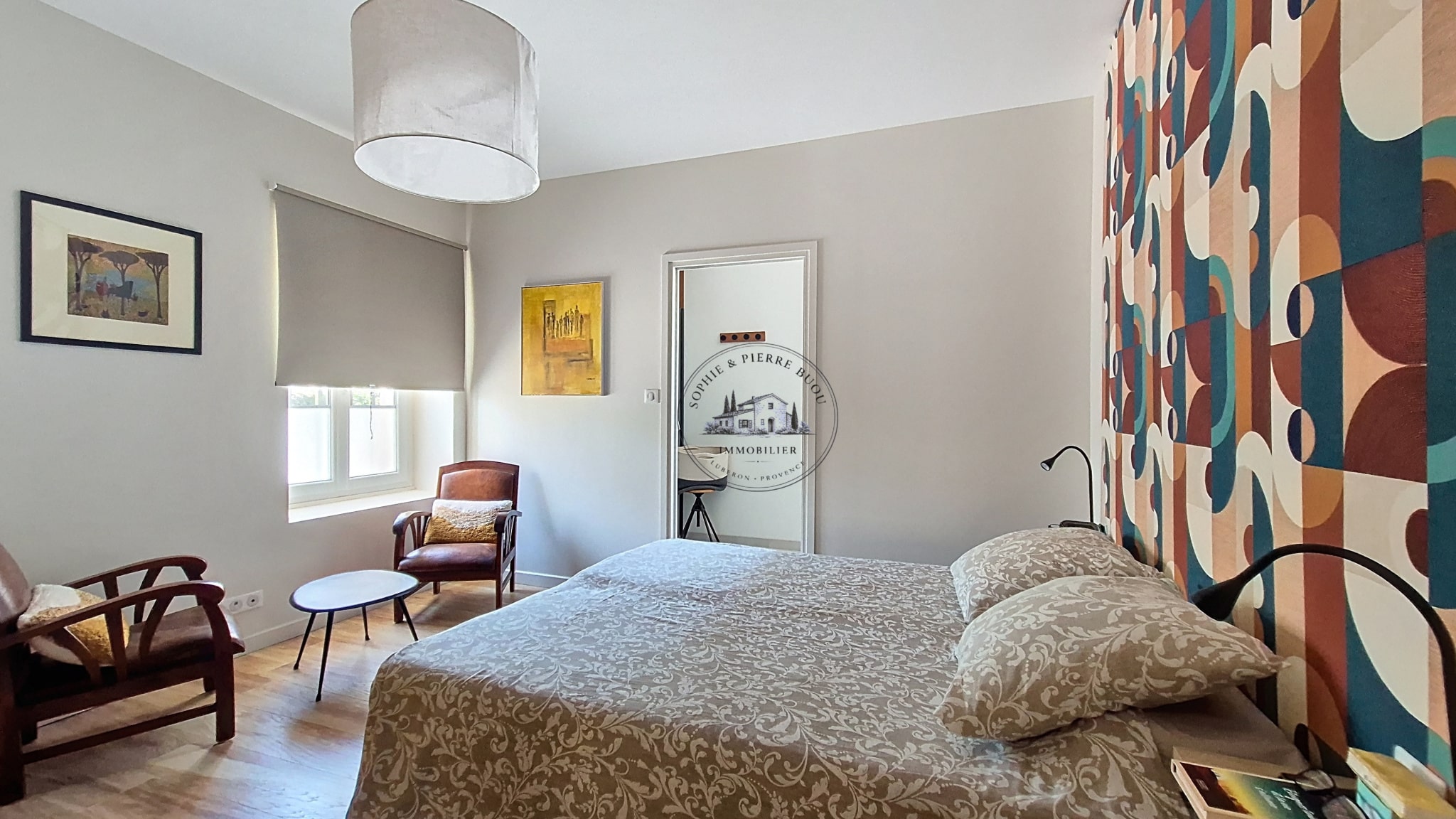 Room in an 18th-century building with modern decor and wooden furniture.