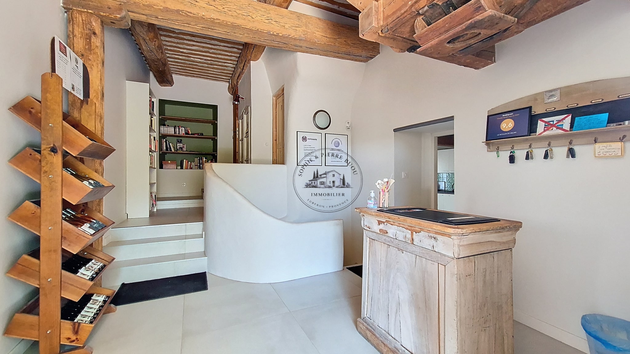 Interior of an 18th-century building with wooden elements and a reception area.