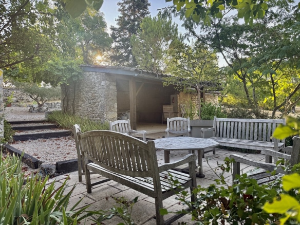 Stone terrace with garden furniture and views of nature, property in Touffailles.