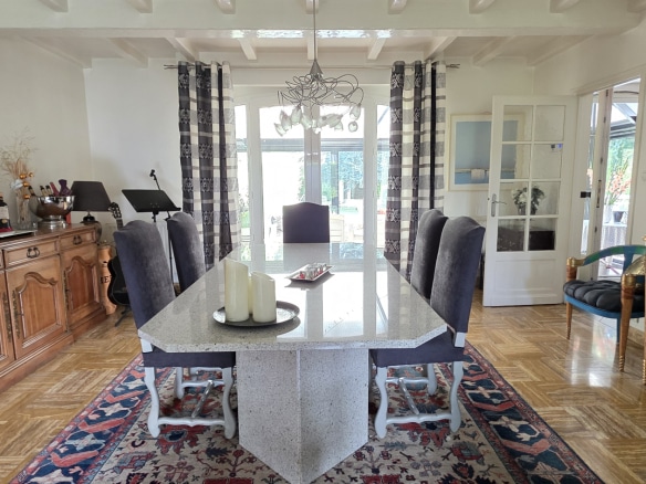 Dining room of a town house in Bauvin with modern table and elegant decoration.