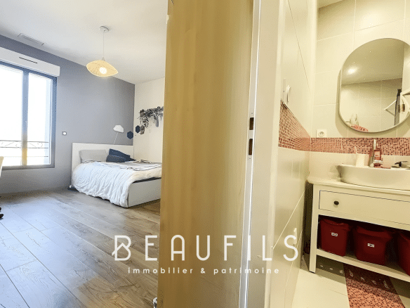Bedroom in a loft in Mauguio with bed, desk and window.