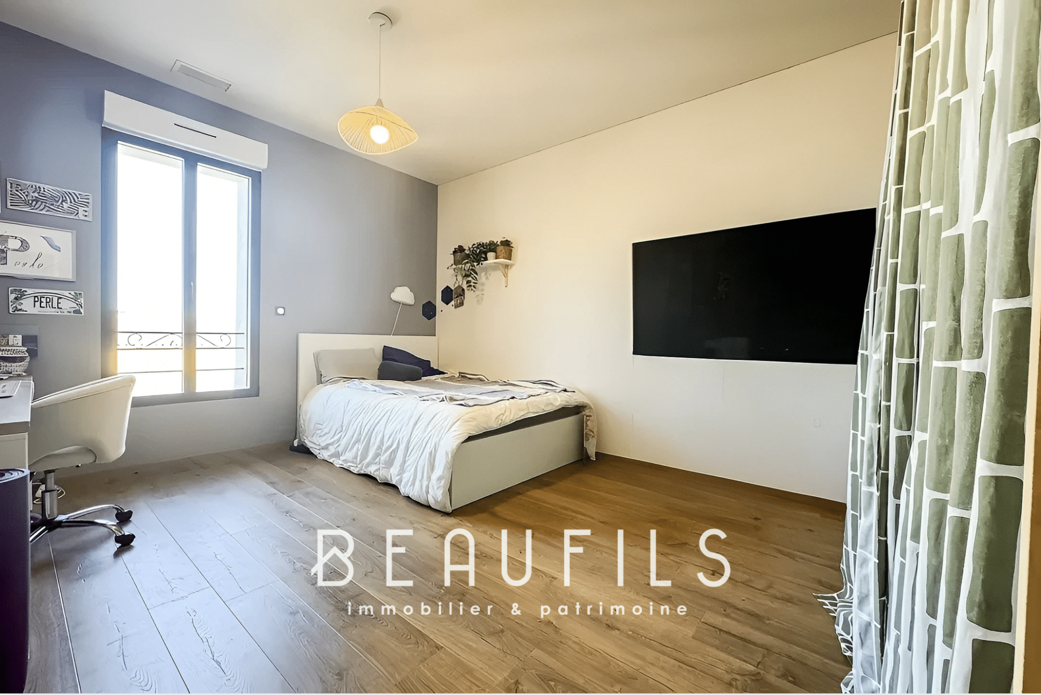 Bedroom in an unusual loft in Mauguio with a bed, a desk and a window.