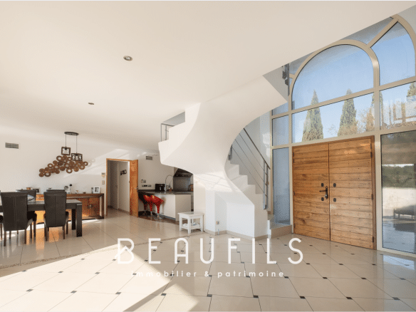 Interior of an architect-designed villa with a cathedral entrance and open-plan living space.