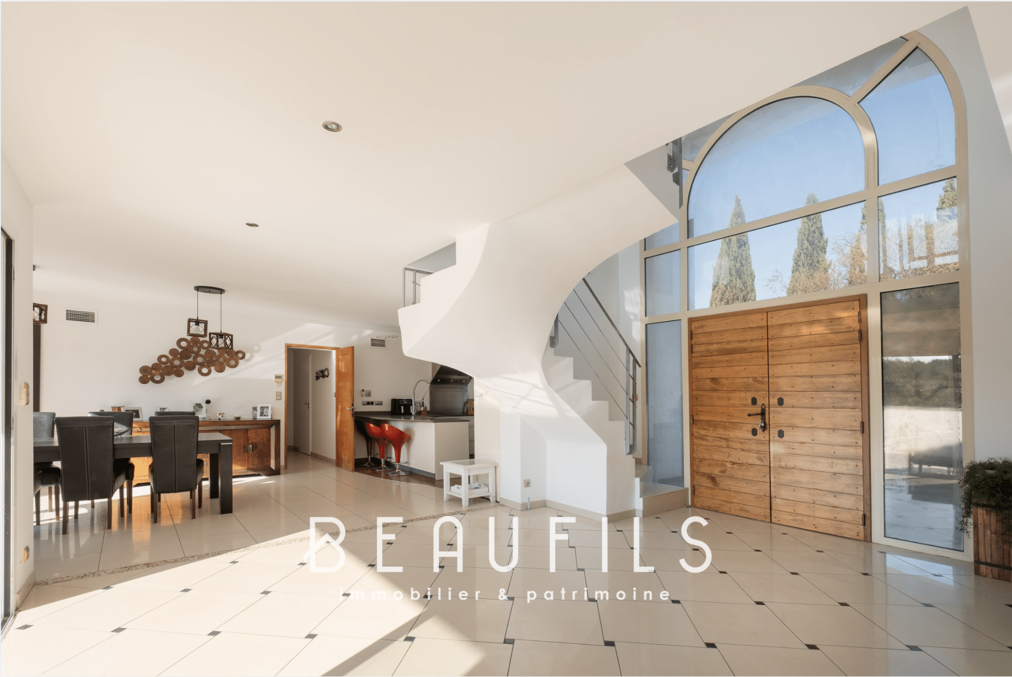 Interior of an architect-designed villa with a cathedral entrance and open-plan living space.