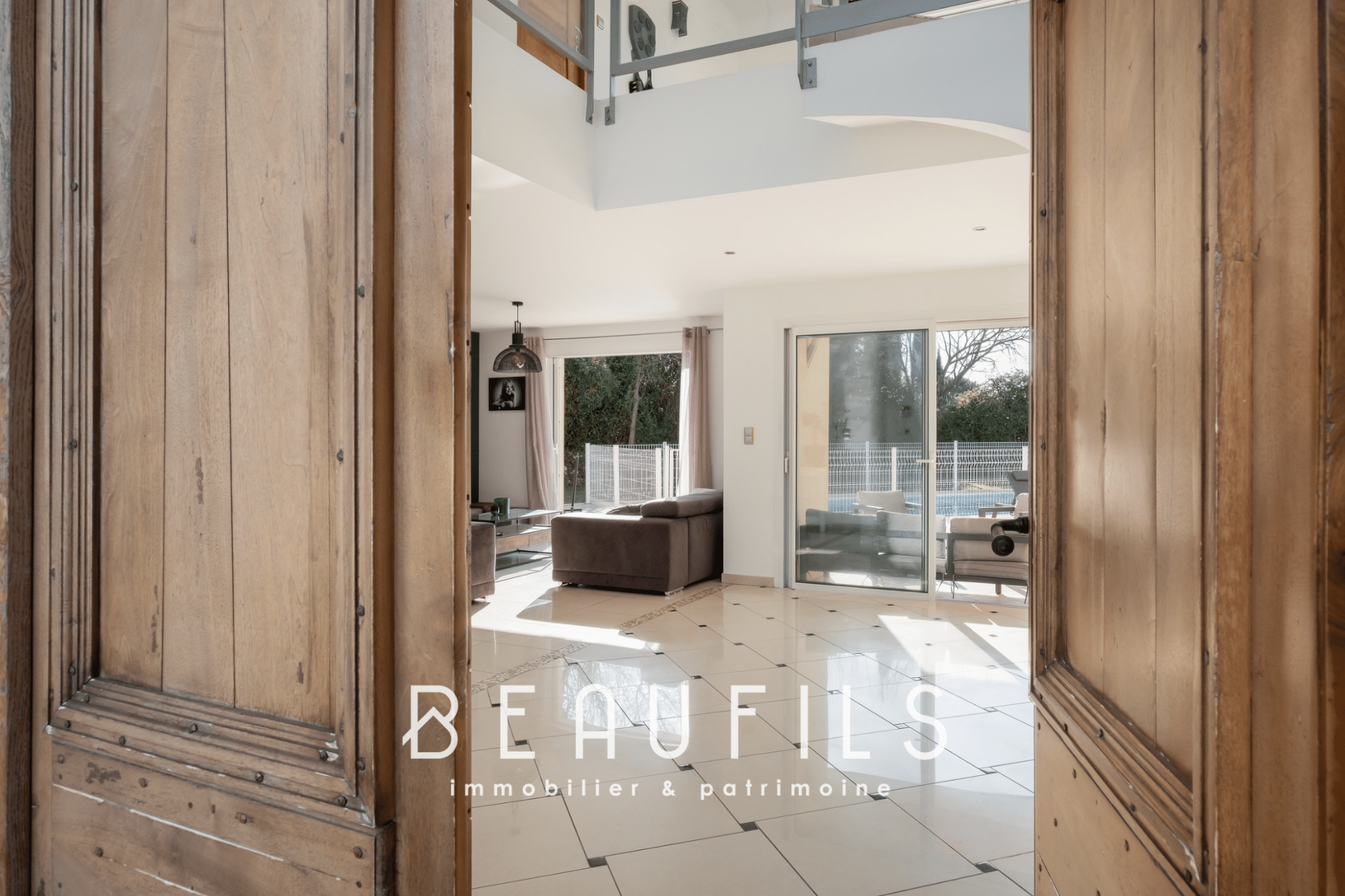 Interior of an architect-designed villa in Nîmes, view from the entrance with a bright living room.