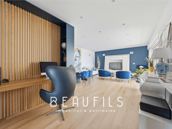 Interior of a modern apartment with contemporary furniture and a sea view.