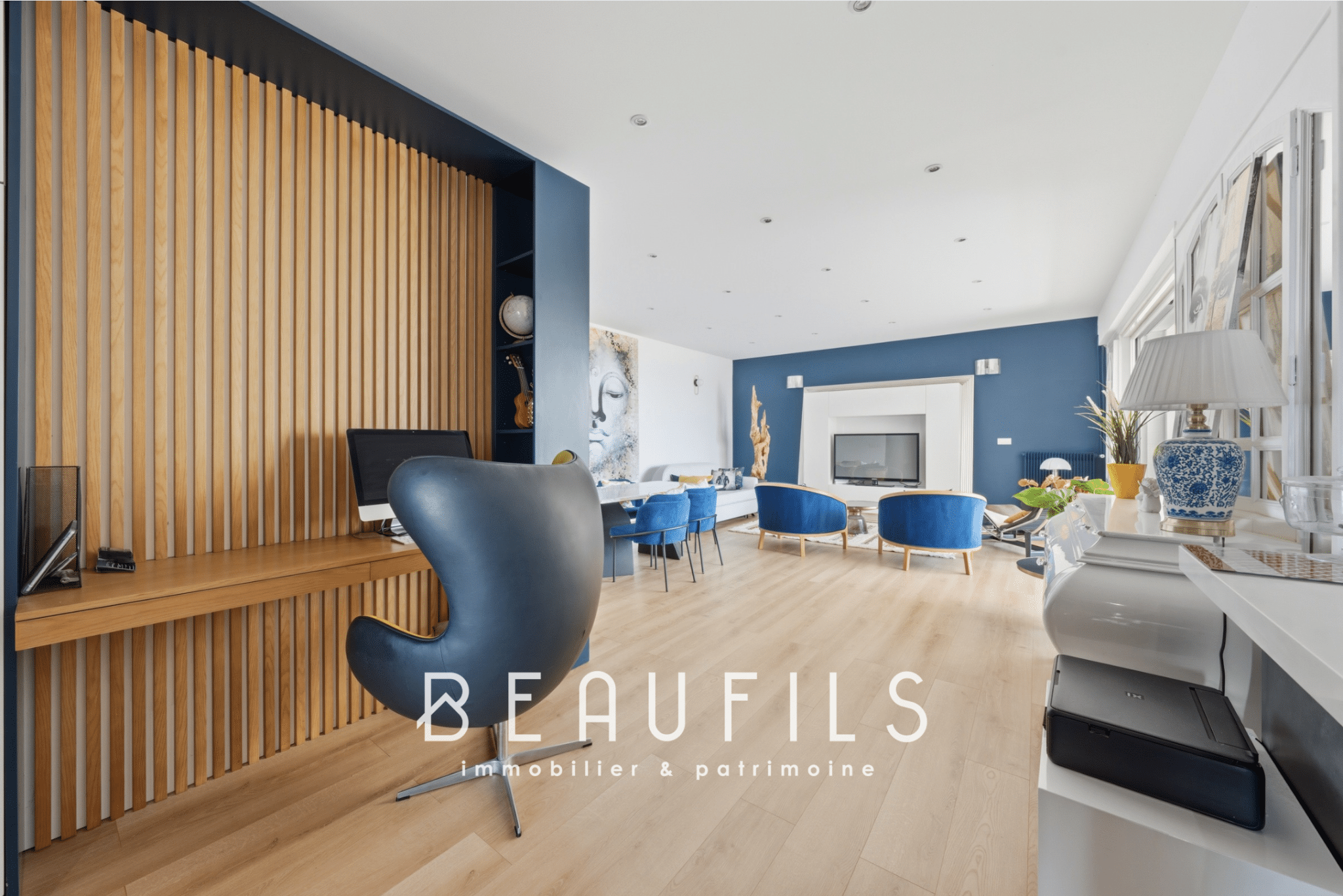 Interior of a modern apartment with contemporary furniture and a sea view.