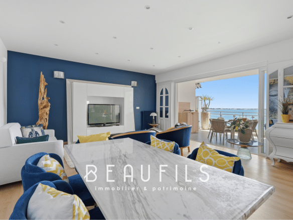 Interior of a renovated apartment with sea view, bright living room and terrace.