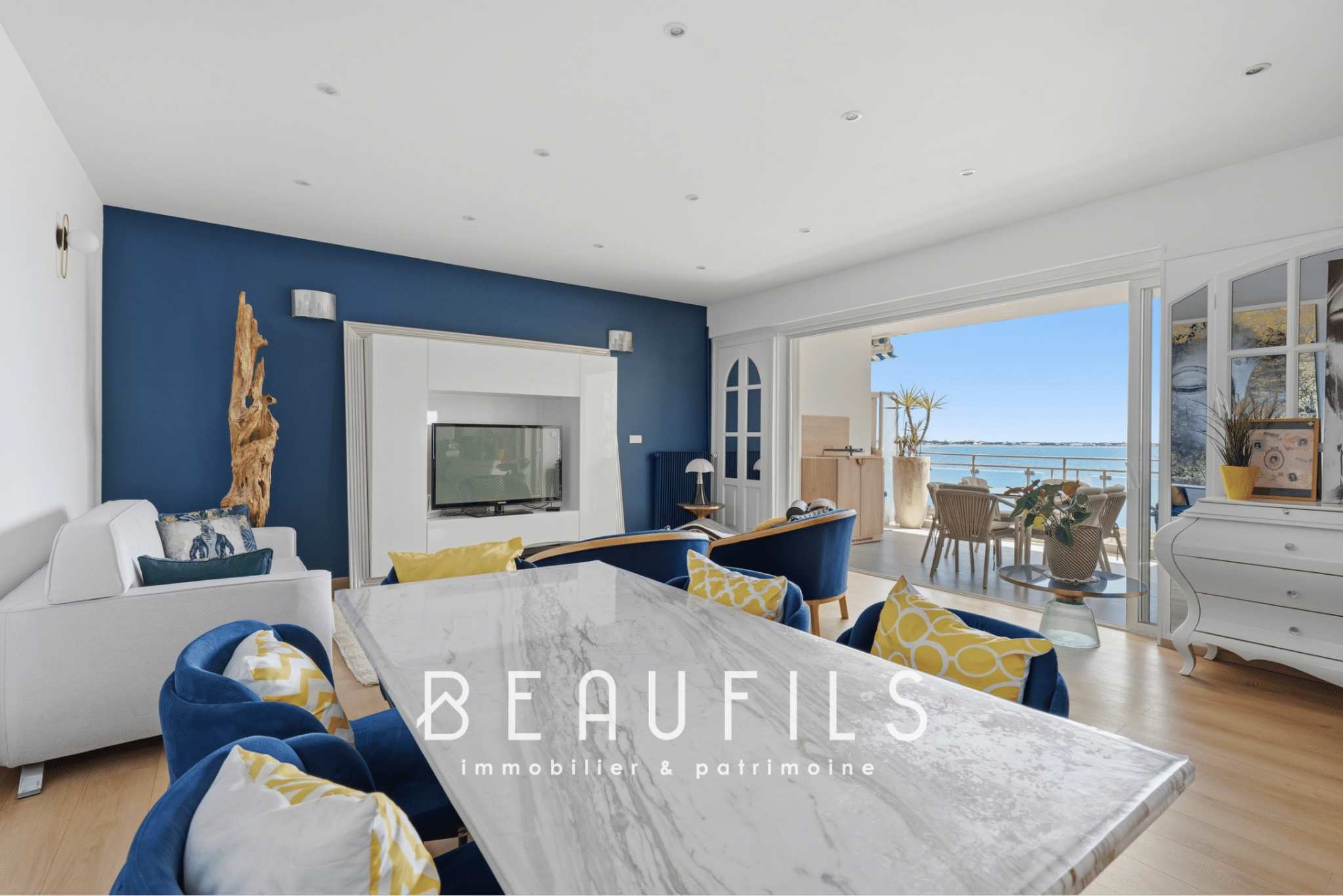 Interior of a renovated apartment with sea view, bright living room and terrace.