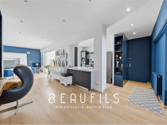 Interior of a modern apartment with living room, open kitchen and contemporary decor.