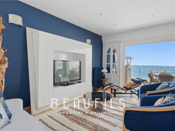 Interior of a renovated apartment with sea view, bright and modern living room in Grau-du-Roi.