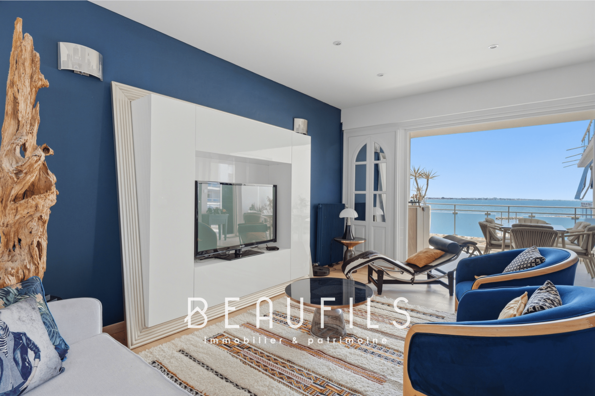 Interior of a renovated apartment with sea view, bright and modern living room in Grau-du-Roi.