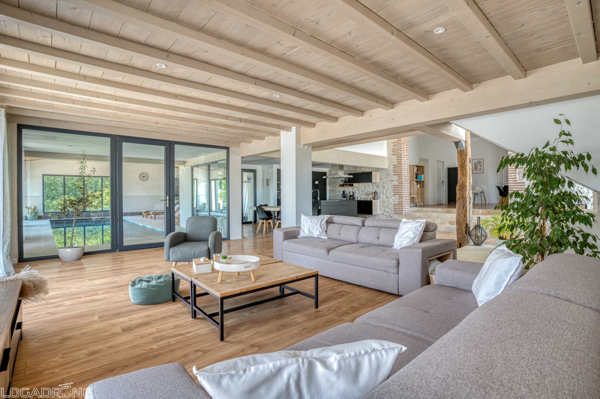 Interior of a renovated stone property with a large, bright and modern living room.