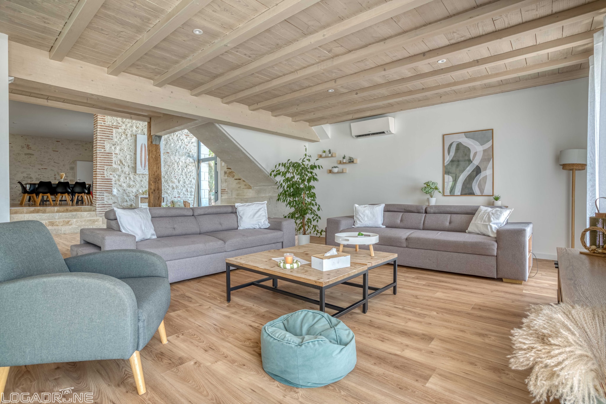 Interior of a renovated stone property with a spacious living room and modern decor.