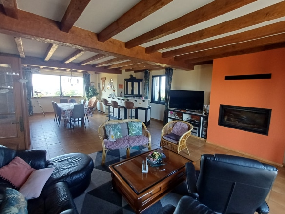 Interior of a house with a sea view, spacious and bright living room.