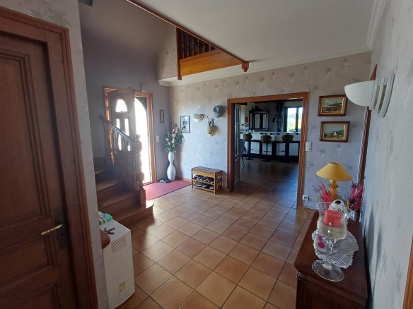 Interior of a house in Plougasnou with entrance hall and view of the living room.
