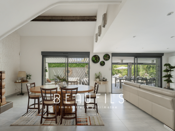 Interior of a renovated Mediterranean villa with open-plan living space and modern decor.