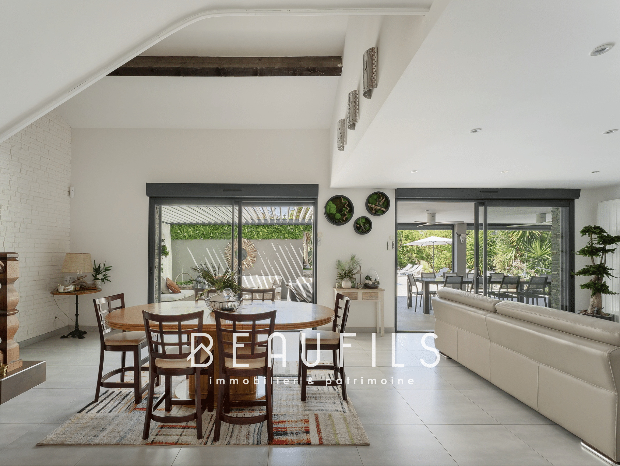 Interior of a renovated Mediterranean villa with open-plan living space and modern decor.