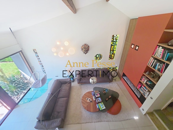 Interior of a modernist villa with a bright living room and contemporary decorative elements.