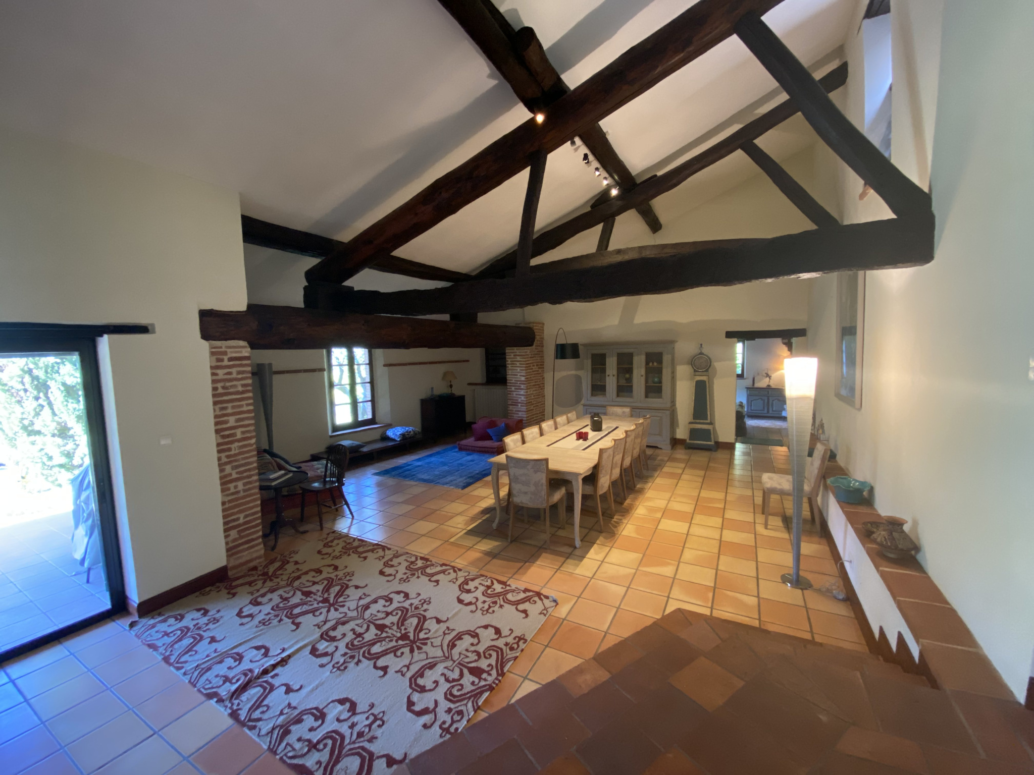 Interior of a country house Interior of a country house with exposed beams and a large dining table.
