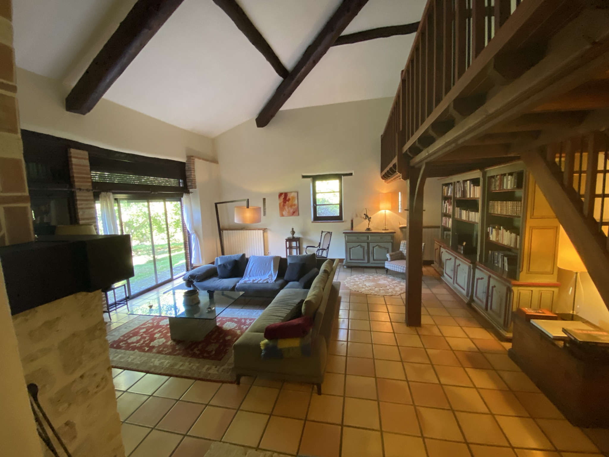 Interior of a country house in Moissac Interior of a country house with a spacious living room and library.