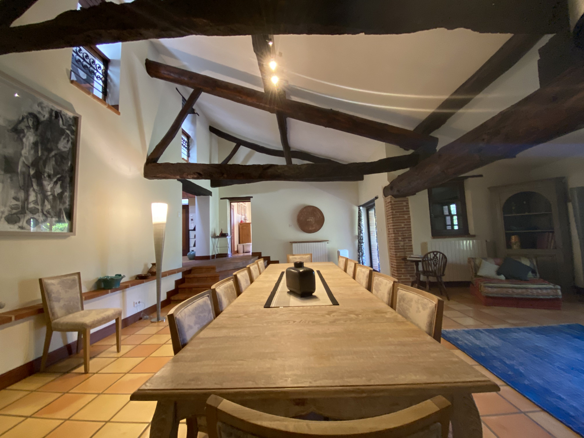 Interior of a country house Interior of a country house with a large dining table and exposed beams.