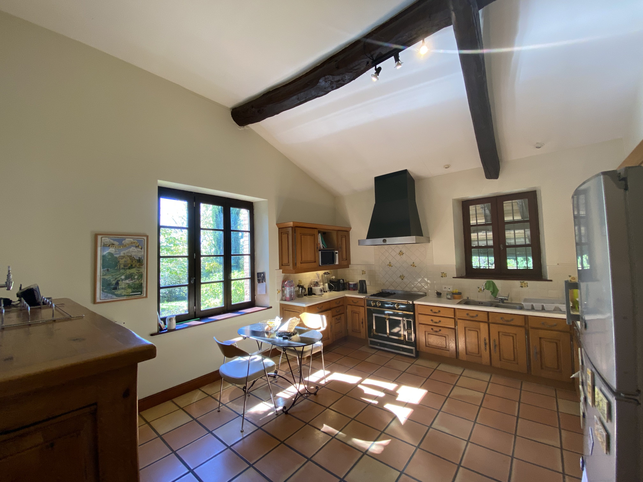 Country house kitchen in Moissac Spacious kitchen with wooden furniture and natural light