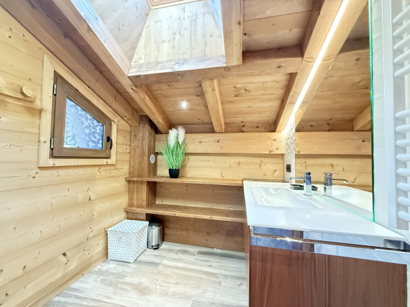Modern wooden bathroom with double sink and natural lighting